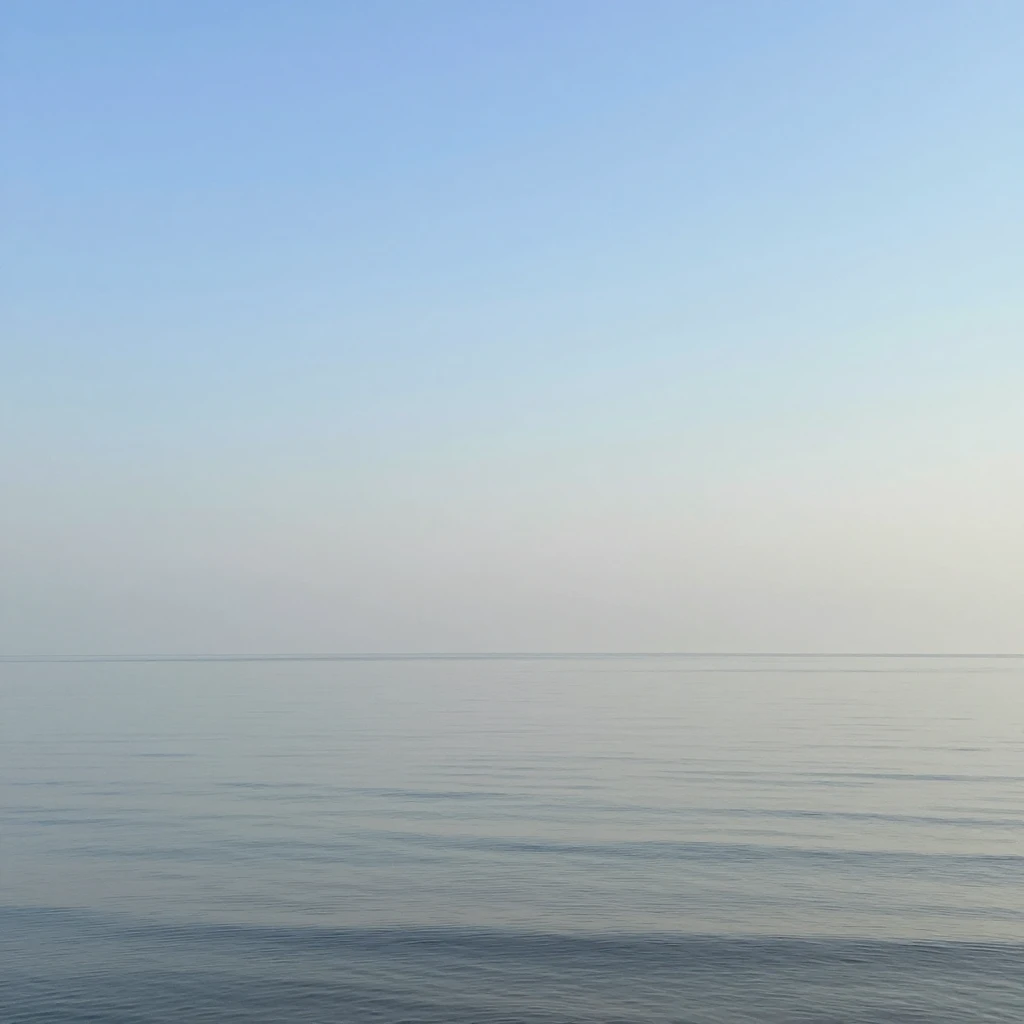 Open horizon over calm water evoking spacious silence